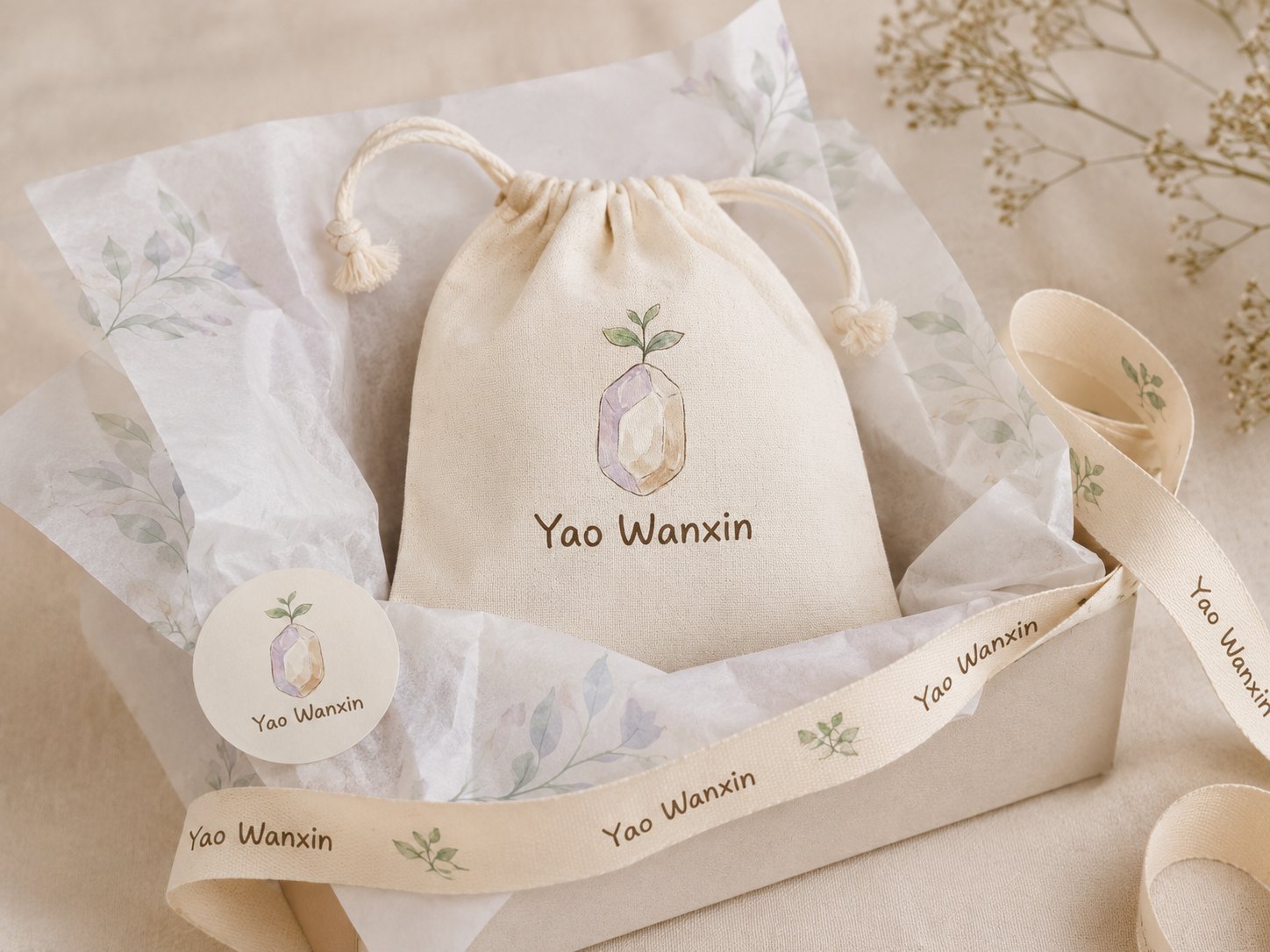 Concept packaging direction with a cotton pouch and printed ribbon